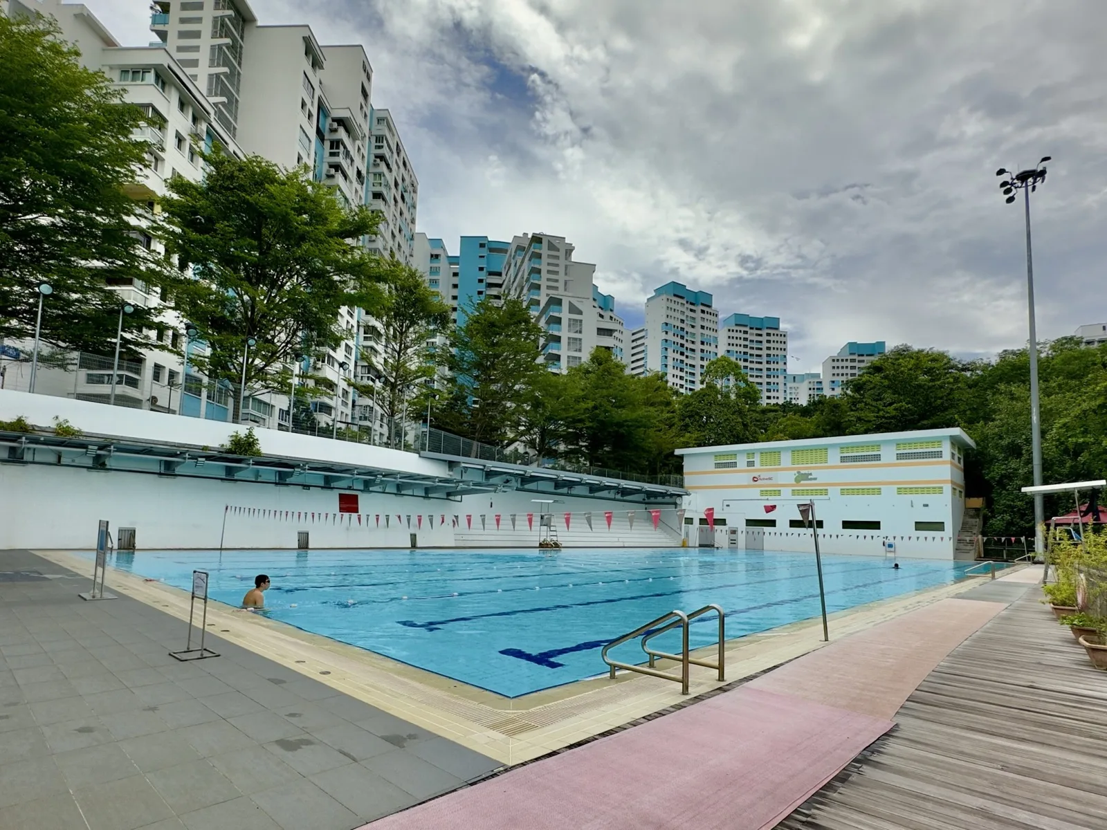 Infinity pool with jacuzzi overlooking greenery at Senja-Cashew Swimming Complex